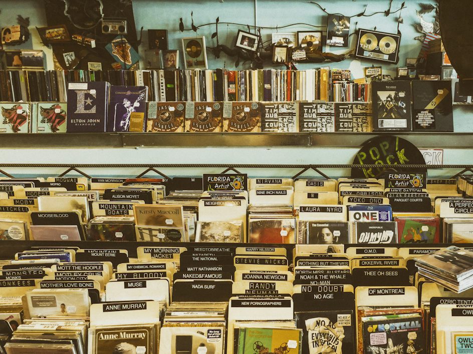 Crates of vinyl records in a bright, busy record shop